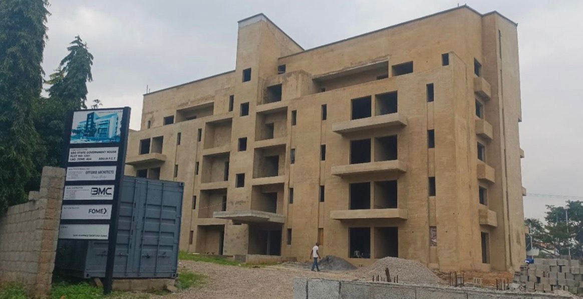 Asokoro 3391 site in Abuja with the project board listing FOMEX among the contractors