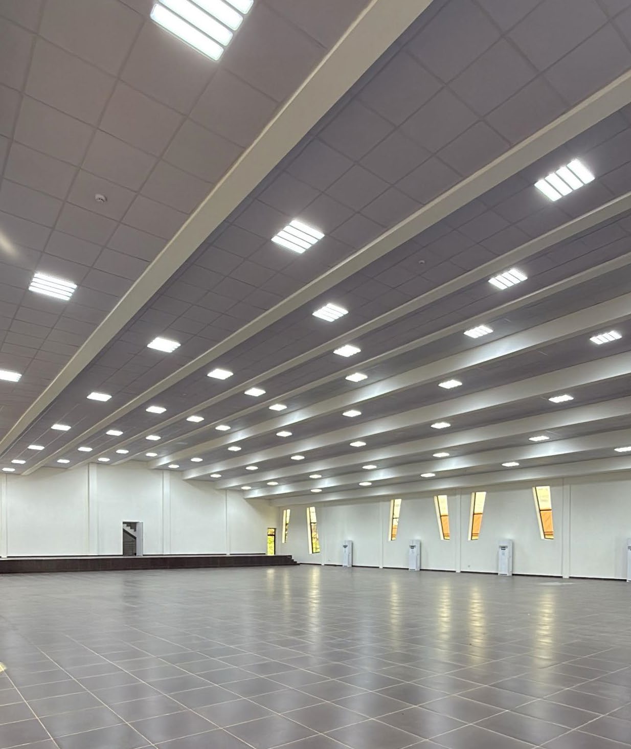 Delivered multipurpose hall at Stella Obasanjo Hospital — lighting, cooling and ceiling systems in operation